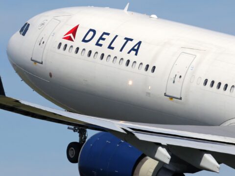 Delta passengers evacuate flight on emergency slides during aborted takeoff