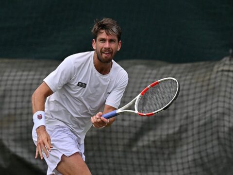 Tennis player hits woman in front row with errant racket throw